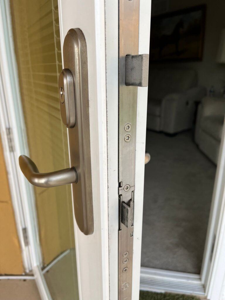storm door lock change baldwin